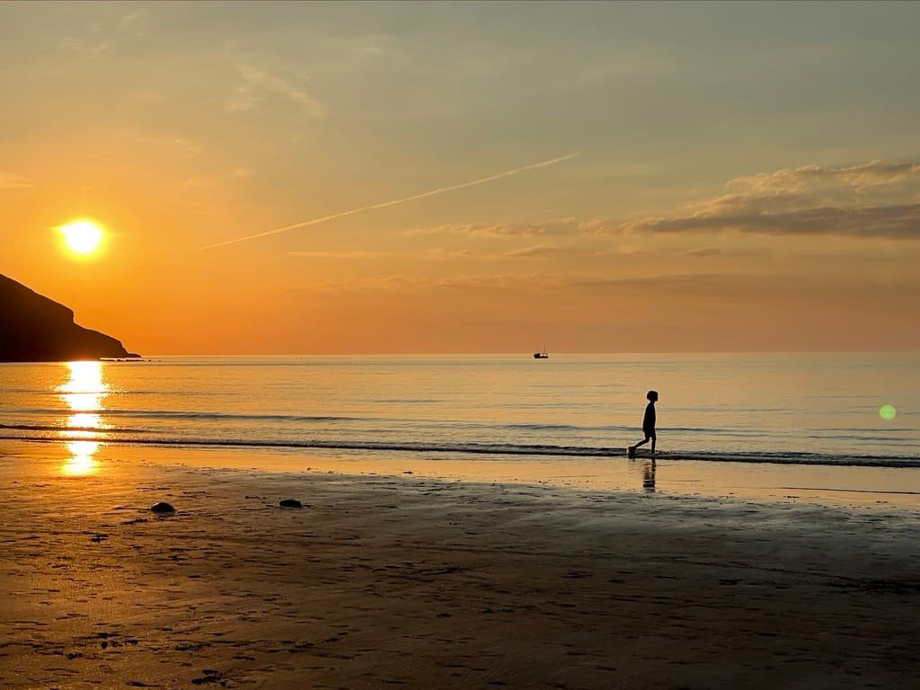 Sunset over Poppit Sands beach